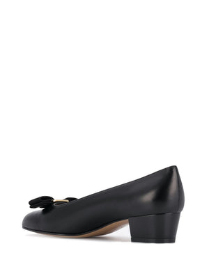 Classic Black Leather Flats with Signature Bow Detail and Low Block Heel for Women