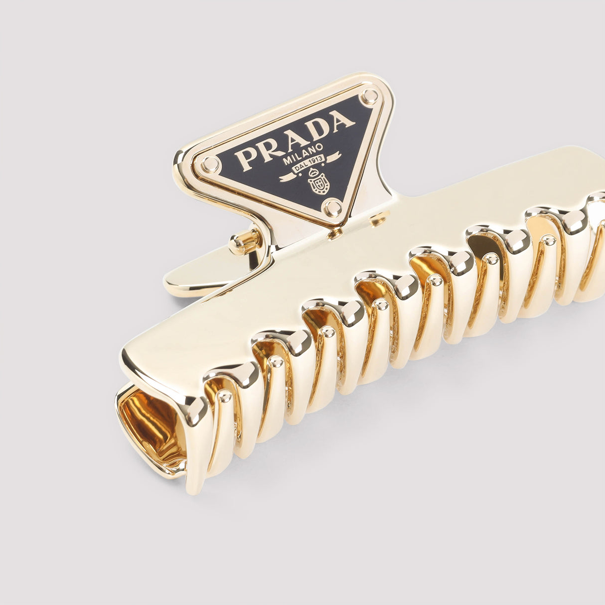 PRADA Chic Brass Hair Clip for Women - Perfect for SS25