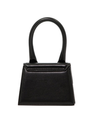 JACQUEMUS Black Leather Mini Handbag with Oversized Handle and Magnetic Flap Closure