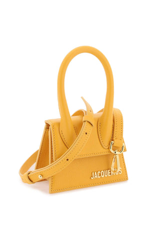 أصلي: حقيبة جلدية بمقبض برتقالي للنساء - مجموعة SS24