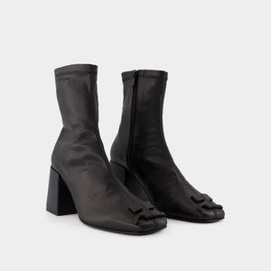 COURREGÈS Chic Mini Ankle Boots in Black Eco-Leather