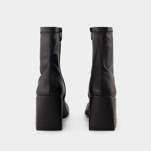 COURREGÈS Chic Mini Ankle Boots in Black Eco-Leather