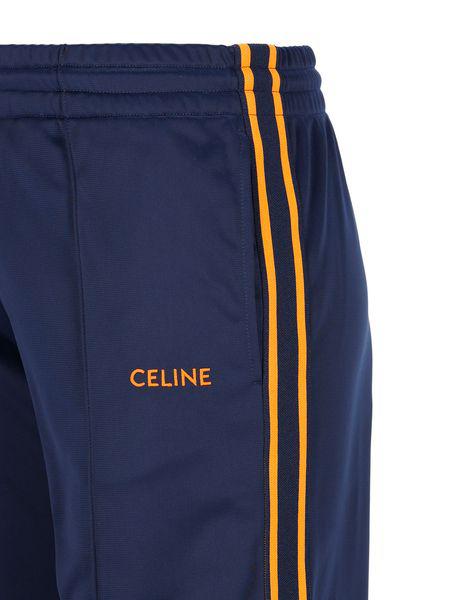 Quần thể thao nhạt asym màu xanh navy có viền cam nổi bật và logo thêu Celine