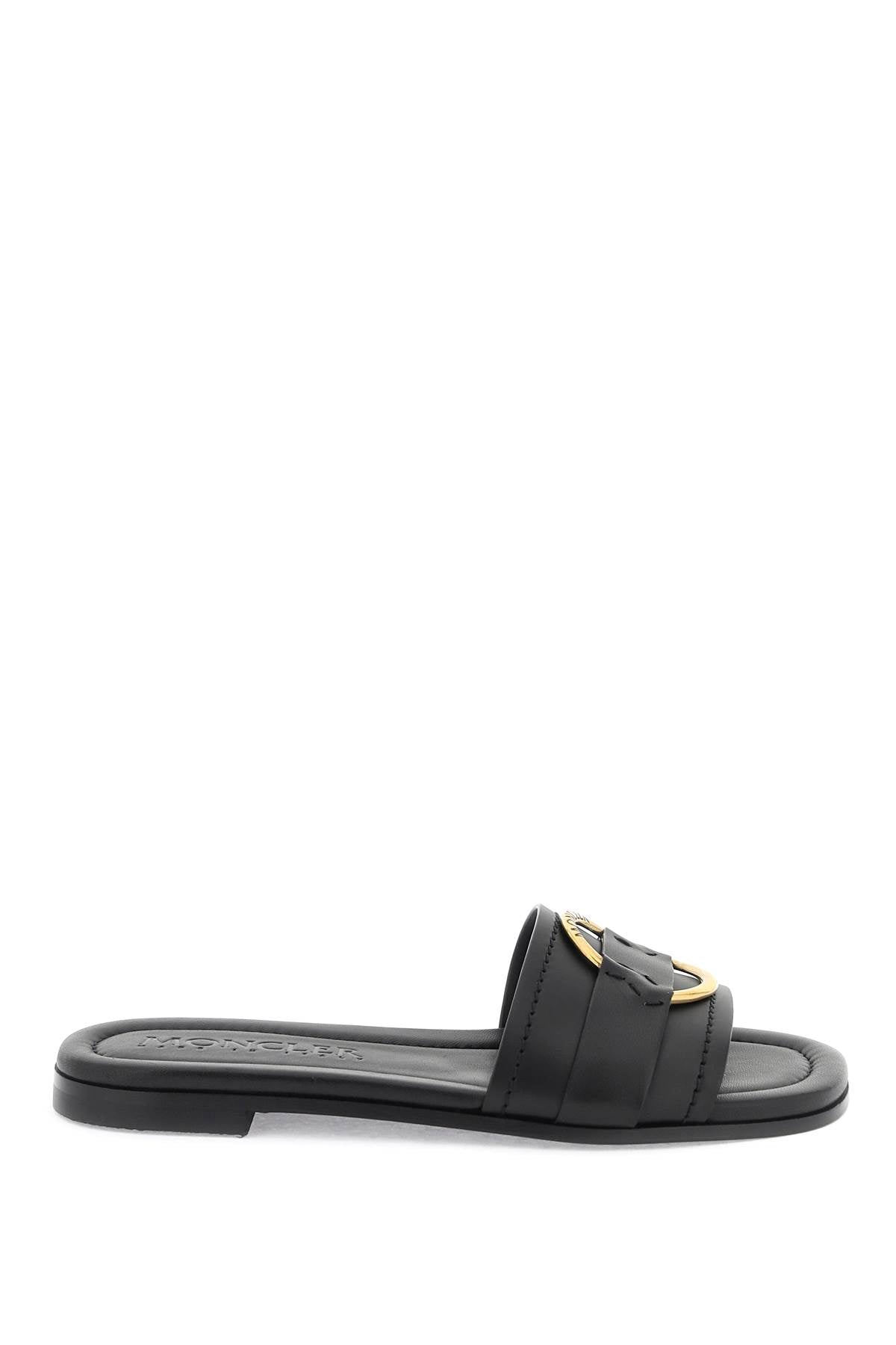 MONCLER Black Calfskin Slide for Women Featuring a Round Toe and Gold Metal Ring Band with Engraved Logo