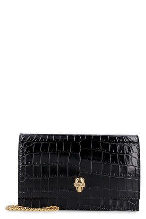 ALEXANDER MCQUEEN Elegant Crocodile Print Leather Clutch with Embellished Metal Skull and Chain Strap