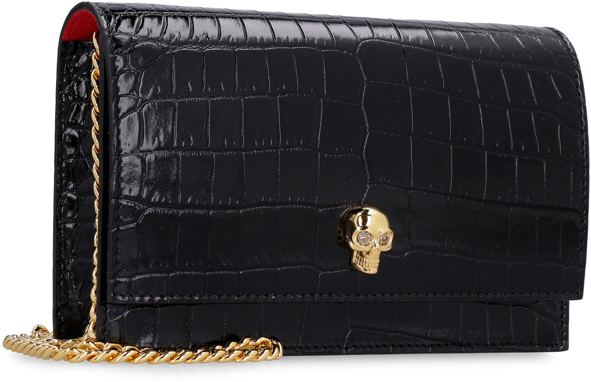 ALEXANDER MCQUEEN Elegant Crocodile Print Leather Clutch with Embellished Metal Skull and Chain Strap