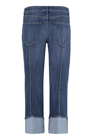 Light Blue Cropped Jeans with Curved Hems and Central Details