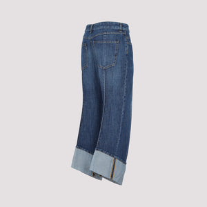 Light Blue Cropped Jeans with Curved Hems and Central Details