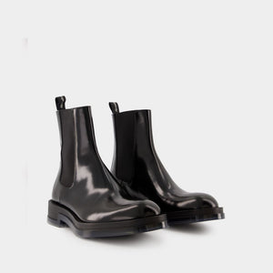 ALEXANDER MCQUEEN Men's Chelsea Float Ankle Boots - Glossy Black Leather, Transparent Sole