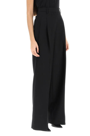 Pleated Wide-Leg Wool Trousers in Black - مجموعة الربيع/الصيف 2024