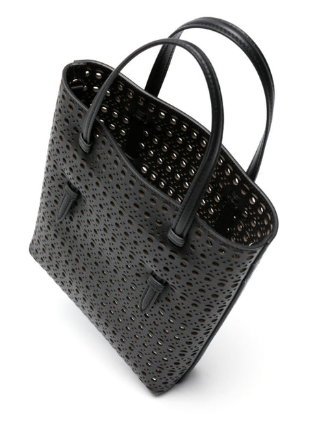 حقيبة يد من جلد أسود مثقبة بتصميم عصري للنساء