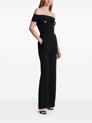 بدلة أنيقة سوداء بتصميم مطوي وتفاصيل ذهبية للنساء
