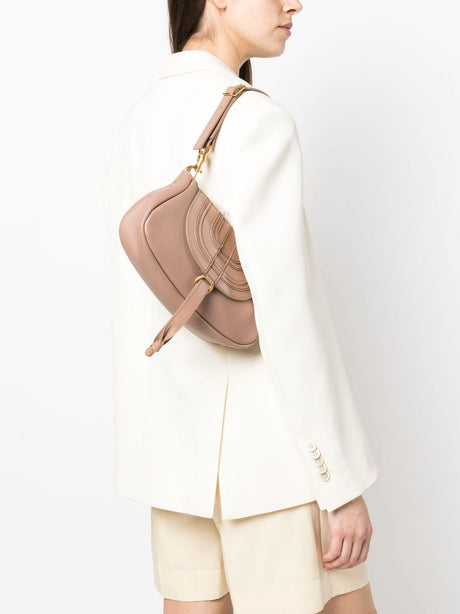Blush Pink Leather Shoulder Bag with Adjustable Strap and Decorative Stitching