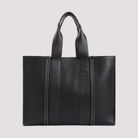 حقيبة يد سوداء أنيقة بطباعة الشعار للنساء