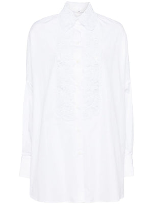 قميص نسائي أبيض فضفاض بتفاصيل دانتيل زهري