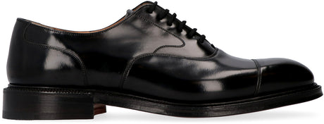 أحذية رجالية جلدية سوداء مربطة برباط، ذات طرف مستدير وتفاصيل ديكورية