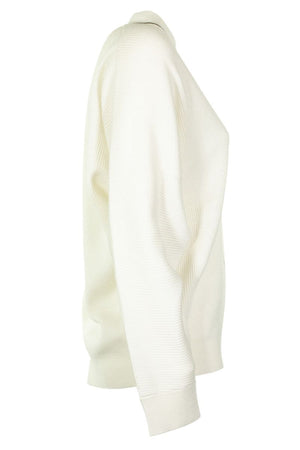 现代白色V领羊绒毛衣搭配珠片装饰