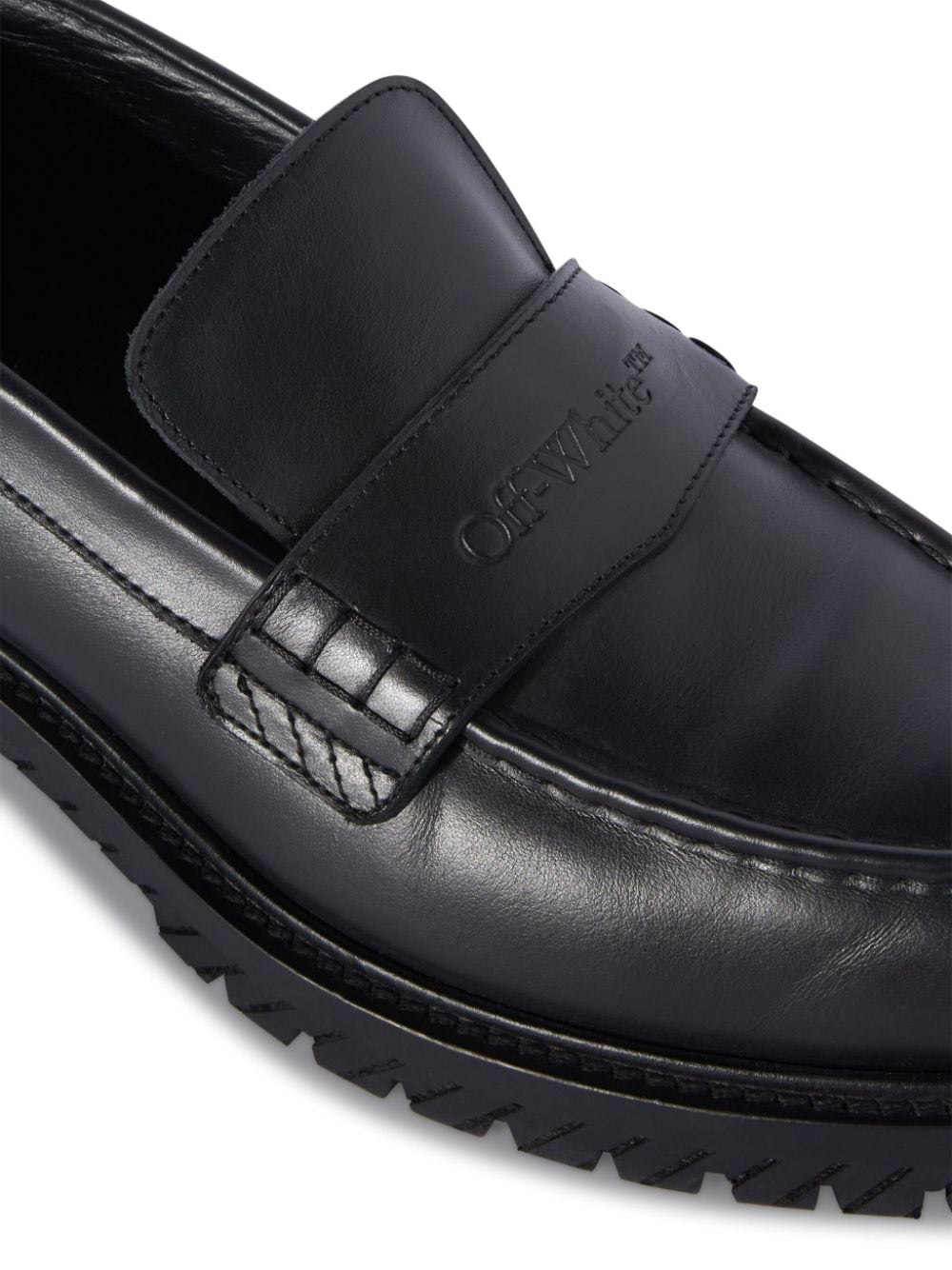 Giày lười da đen với logo cách điệu cho nam