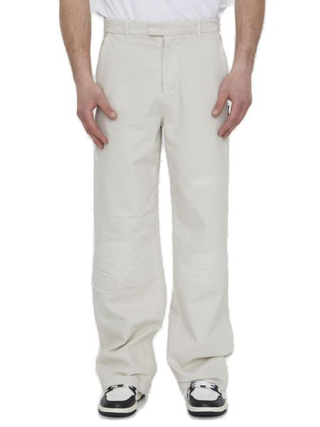 AMIRI Relaxed Fit Cream-Colored Distressed Denim Jeans for Men - SS23