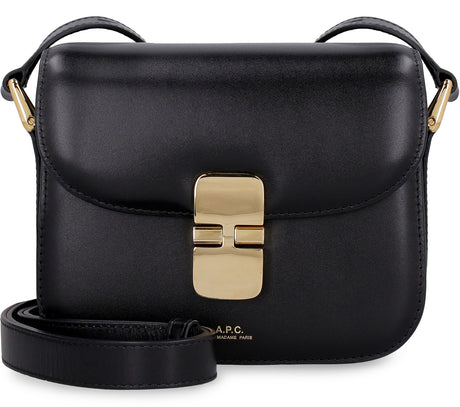 حقيبة يد جلدية سوداء صغيرة مع تفاصيل ذهبية وحزام قابل للتعديل