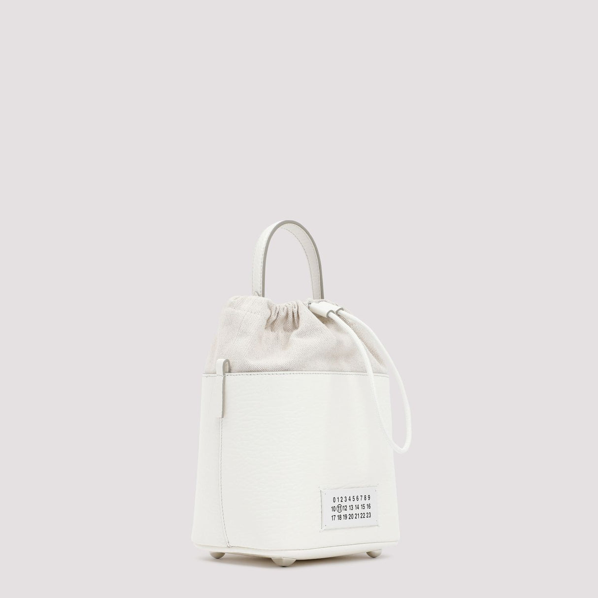 MAISON MARGIELA Mini Bucket Designer Handbag in Hammered Leather with Detachable Strap and White Logo Label - Black