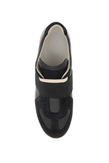 حذاء سنيكرز نسائي جلدي أسود بشريط مطاطي