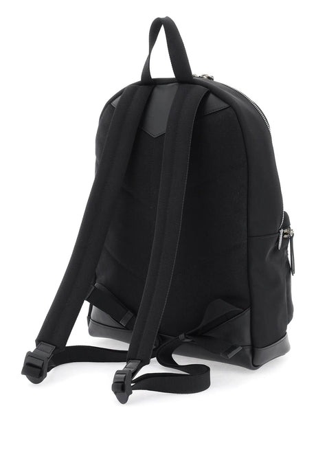 حقيبة ظهر نايلون سوداء بقاعدة جلدية وتفصيل شعار متناقض