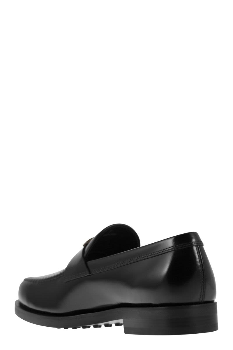 TOD'S Men's Black Semi-Gloss Leather Loafers with Iconic Metal T Accessory