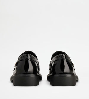 TOD'S Elegant Black Patent Leather Loafers with Brogue Detail